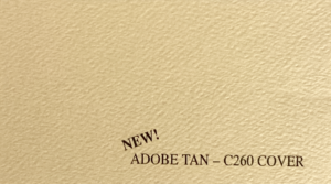 Textured beige surface with embossed text: "NEW! ADOBE TAN – C260 COVER" in the lower right corner, conveying a fresh and elegant tone.